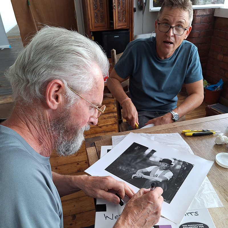 Tony signing a print of Shane for Shane.